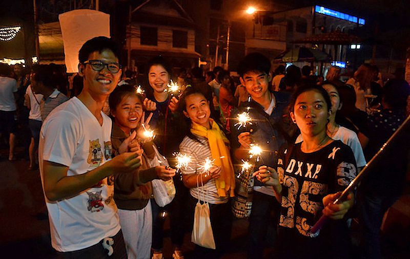 Teenagers lighting up more than their krathongs