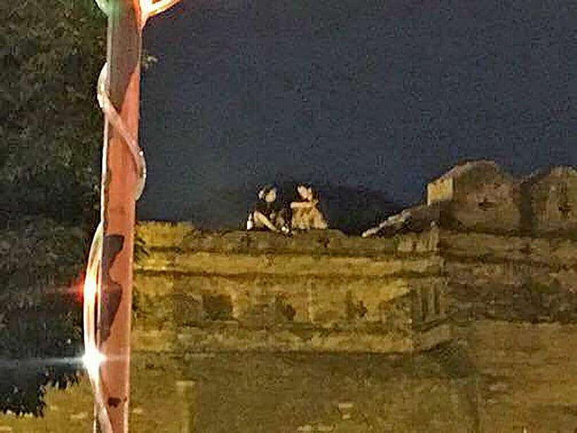 Foreign couple drinking on top of Chiang Mai’s historic wall