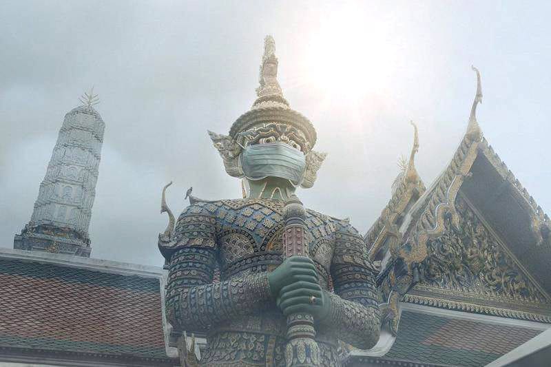 Facemasks on sacred statues gets BKK photographer into hot water