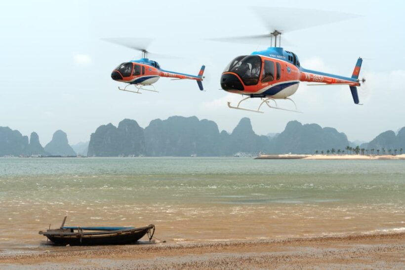 Helicopters high over Halong Bay, Vietnam