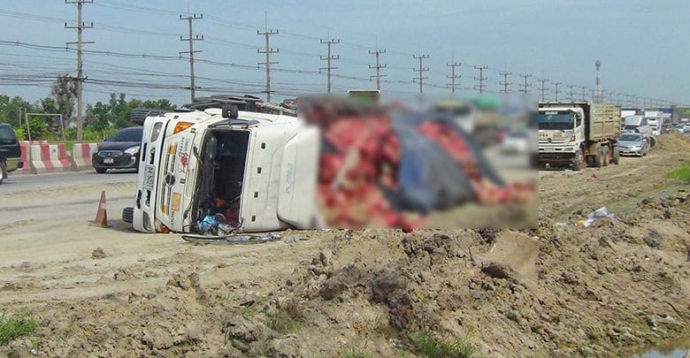 Truck carrying 30,000 bottles of beer rolls over