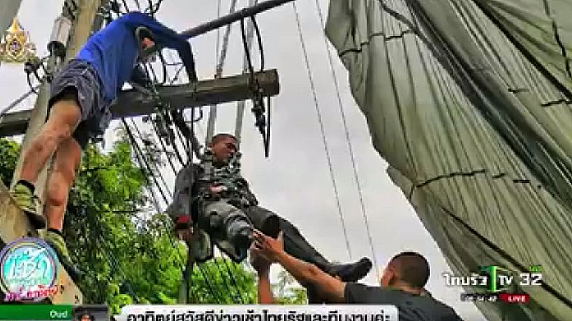 Policeman recovering after parachute jump lands him in overhead electrical wires