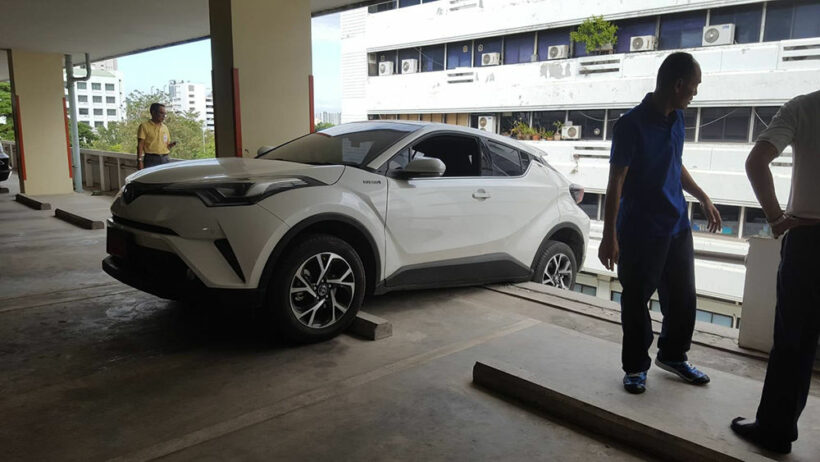 Thai driver nearly sends car into reverse plunge from fourth floor of car park