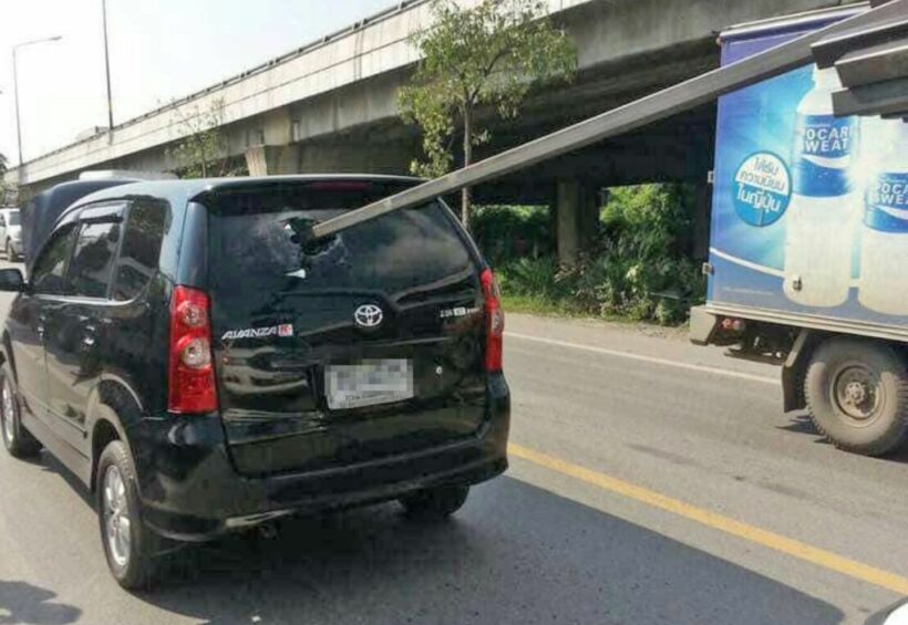 Loose steel pipe spears car through the back window