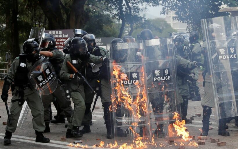 Protestor shot, man burns in Hong Kong unrest