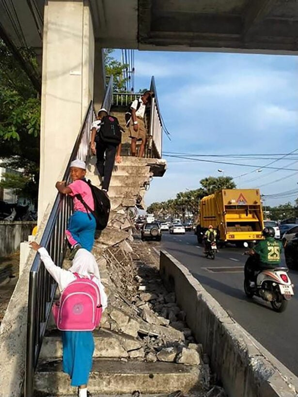 Students clamber up destroyed stairway to get to school in Phuket