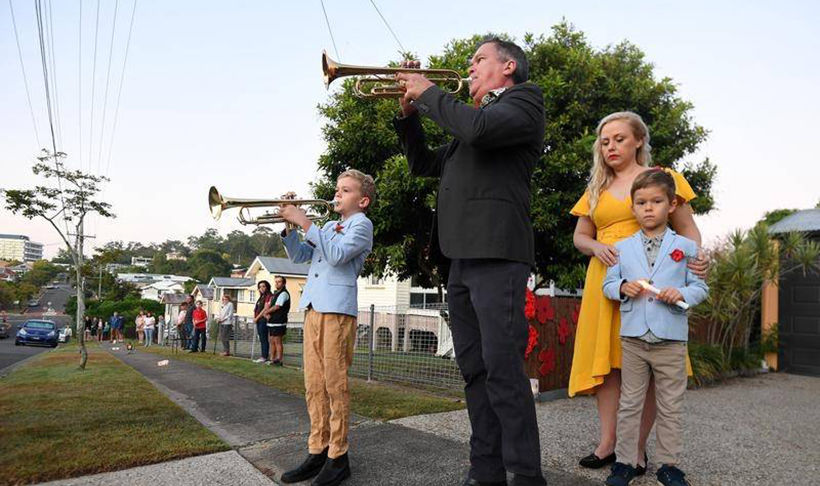 Australians and New Zealanders commemorate ANZAC Day with driveway tributes