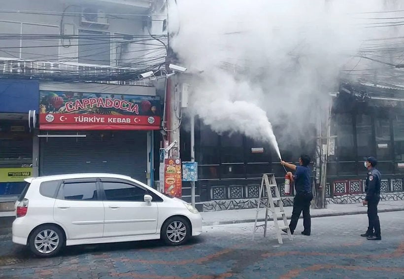 Crane truck hits power lines, starts electrical fire in Pattaya’s Walking Street