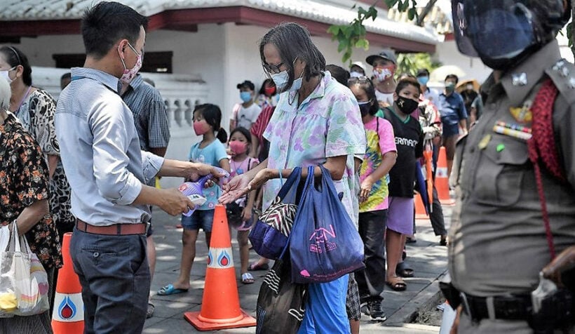 Chinese businessmen hand out food in Pattaya