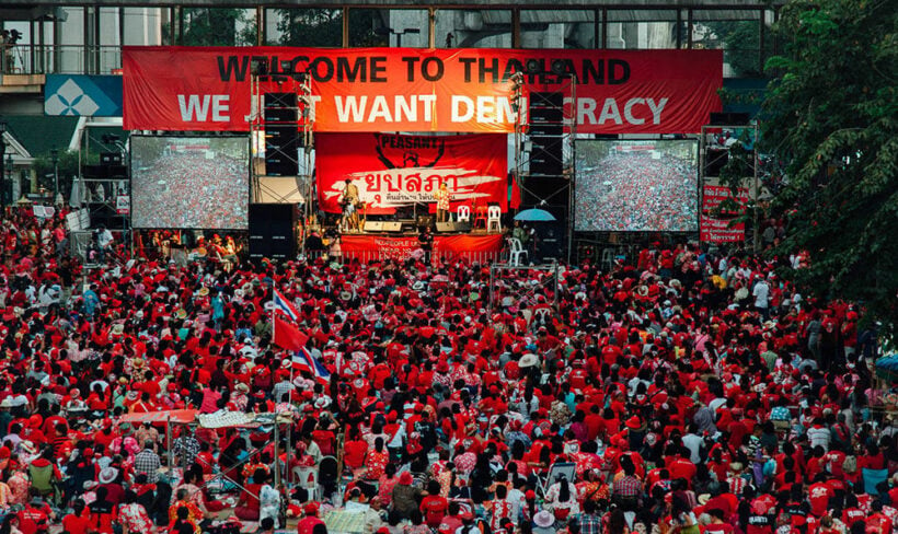 Bangkok police hunt activists who projected slogans onto landmarks of 2010 protests