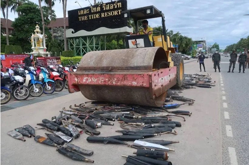 Chon Buri police hire a steam roller to destroy over 700 illegal motorbike exhausts