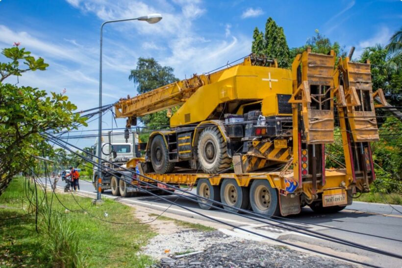 Chon Buri crane truck pulls down over a dozen power poles