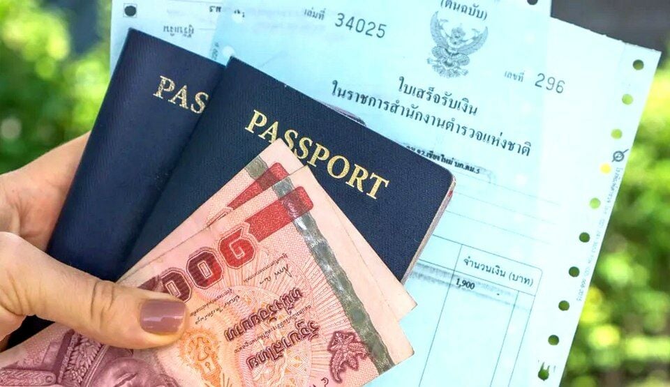 Image of a hand carrying two thai receipts, two passports, and two hundred thai baht