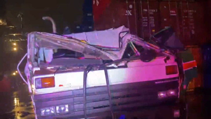 Strong winds “blow” shipping container off a stack and onto a truck, injuring the driver