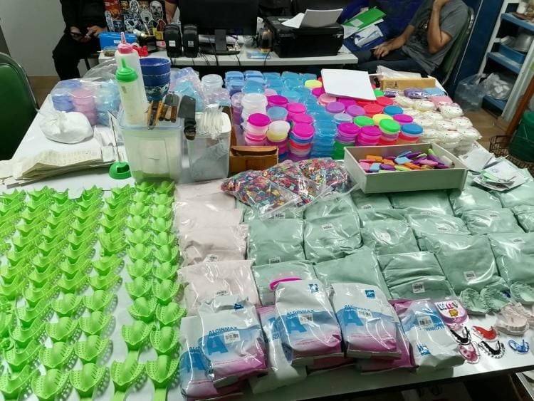 Police arrest woman for allegedly selling fashion dental retainers