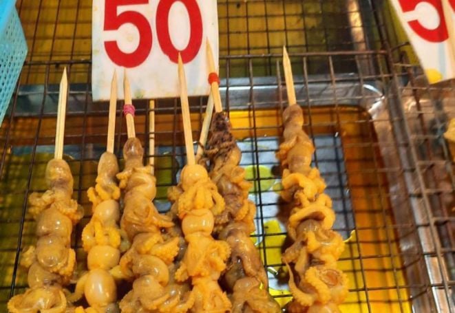 Venomous octopus grilled and up for sale at Pathum Thani market