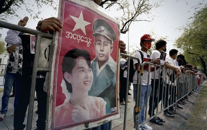 Burmese nationals rally outside UN office in Bangkok to protest against Myanmar coup