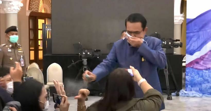 Thai PM Prayut Chan-o-cha sprays hand sanitiser at reporters – VIDEO