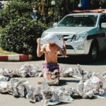 University student carves &#8220;112&#8221; into chest after being charged with violating lèse-majesté law | Thaiger