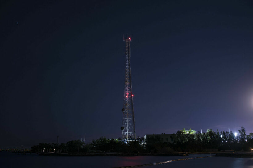 Monk talks man down from a telephone tower in Sattahip