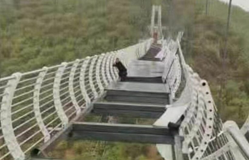 Glass bridge in China shatters, tourist hangs on 100 metres above the ground