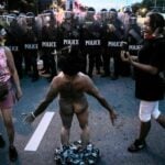 Police arrest protesters yesterday including naked woman | Thaiger