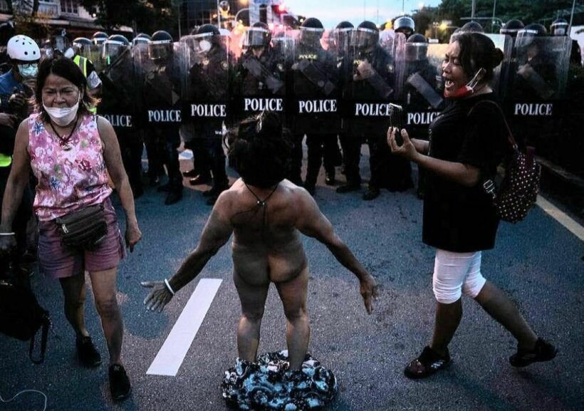 Police arrest protesters yesterday including naked woman