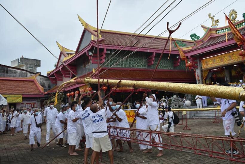 Phuket Vegetarian Festival kicks off, poles raised to call spirits down from the heavens