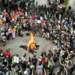 Protesters march to German embassy, present statement against monarchy | Thaiger