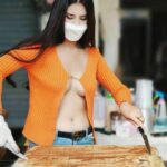 Chiang Mai street vendor goes viral for showing skin to sell sweets | Thaiger
