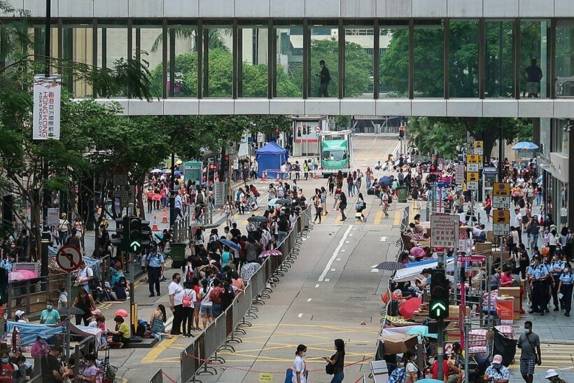 Hong Kong officials eye China-style lockdown, as bodies pile up in hospitals