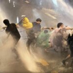 Police use water cannons to stop illegal water fight/protest at Democracy Monument | Thaiger