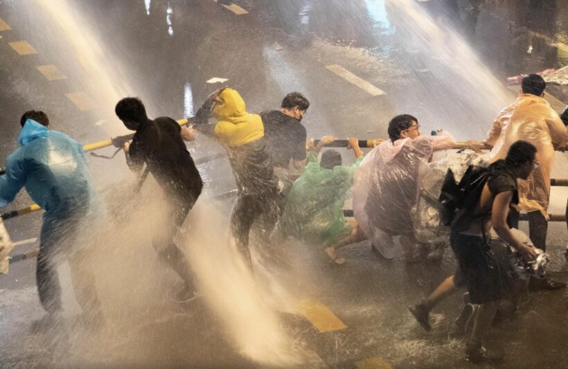 Police use water cannons to stop illegal water fight/protest at Democracy Monument