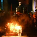Bomb thrown at PM Prayut’s house, protesters burn coffin decorated with his image | Thaiger