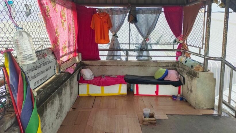 Homeless Thai man turns pedestrian overpass into bedroom