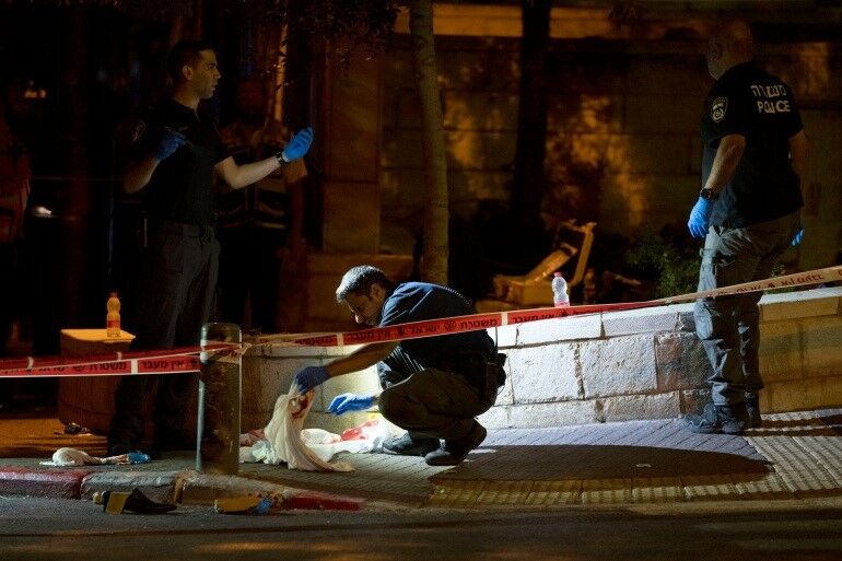 Gunman wounds 8 in Jerusalem, 48 dead in Israeli Gaza strikes