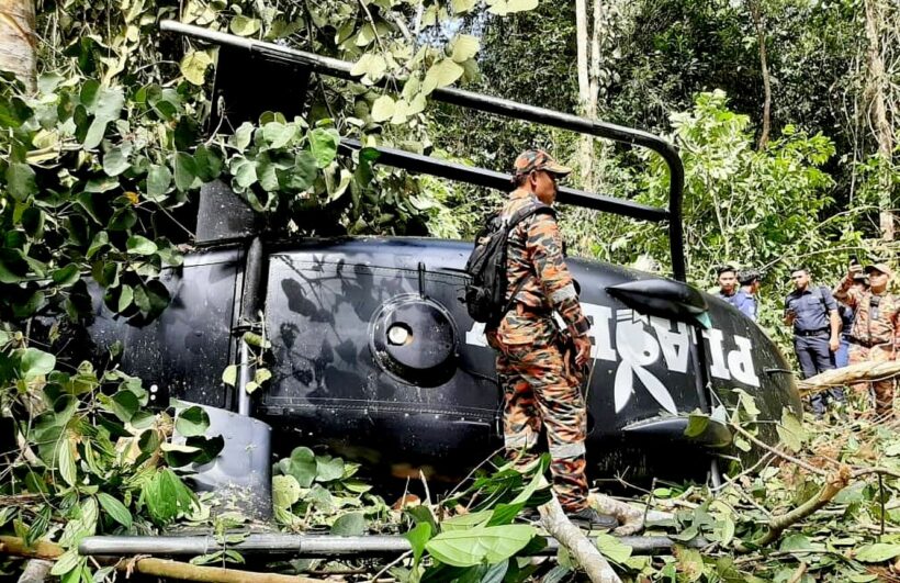 Helicopter crash in Malaysia reported pilot alive, then dead