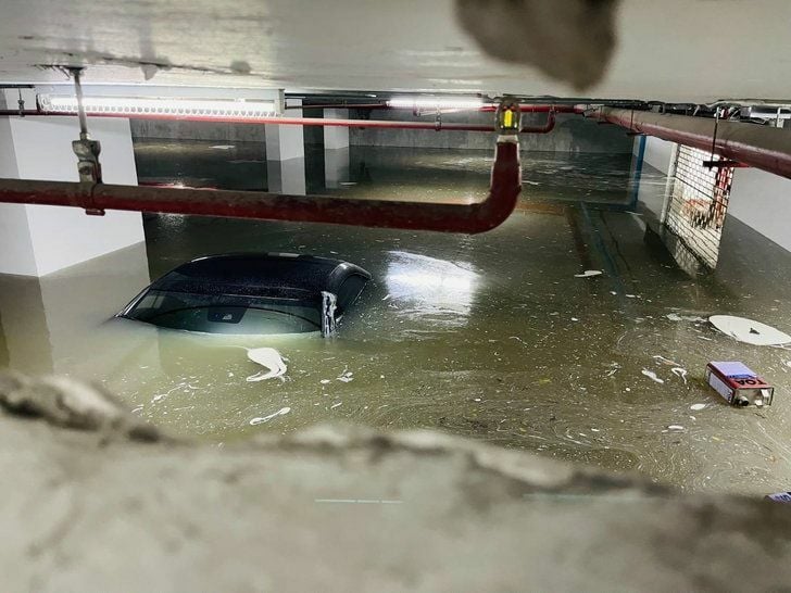 Floods leave cars underwater at Bangkok condo