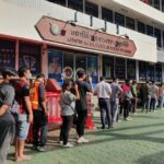 Locals queue to get access to their homes during APEC meeting | Thaiger