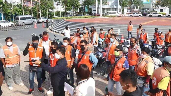 Motorcycle taxi riders rally against unlicensed ride-share app drivers in Pattaya