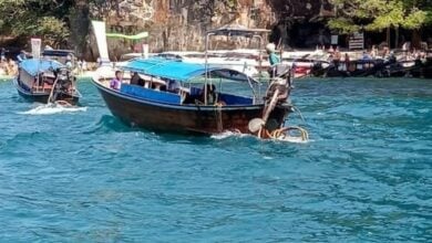 Longtail boats with roofs pulled after several capsized