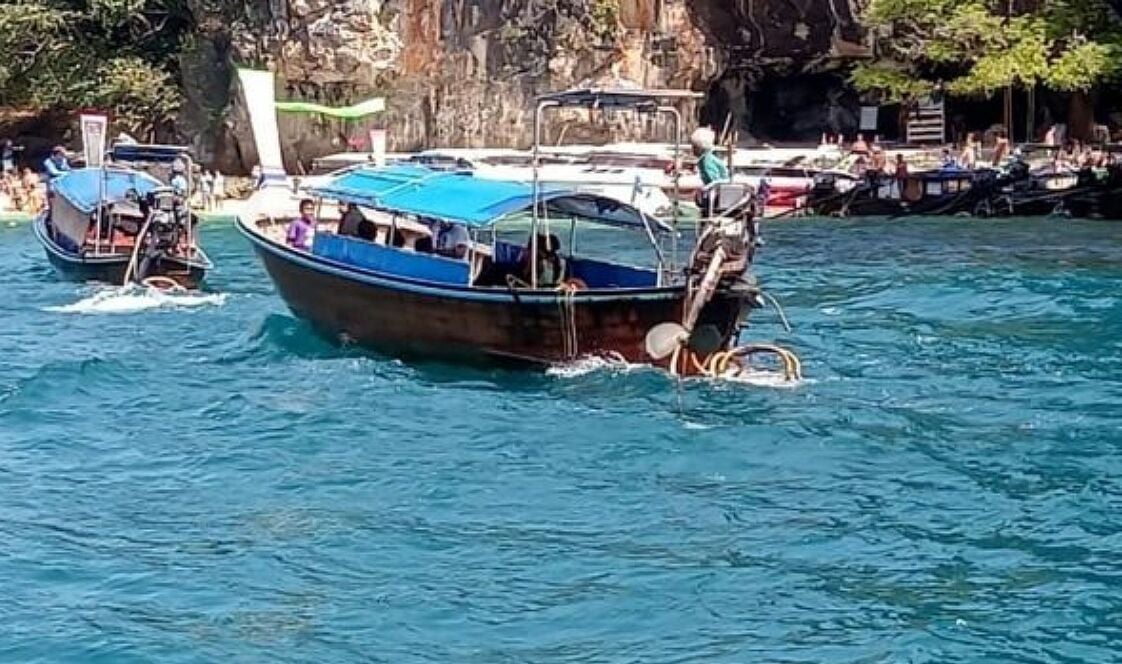 Longtail boats with roofs pulled after several capsized