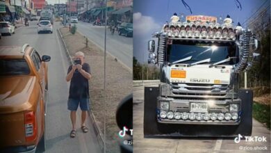 Ignorant foreigner stops traffic to take pictures of a 10-wheel truck