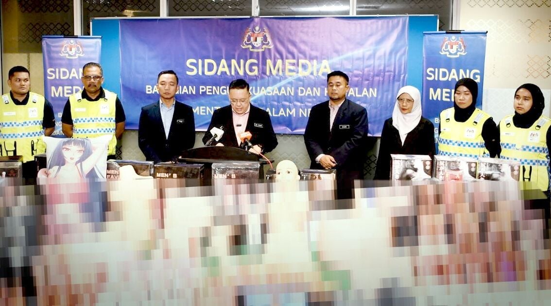 Malaysian officials pose with sex toys seized from home Thaiger