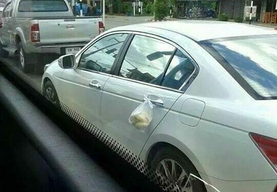 Motorist goes viral for hanging bags of durian on car to avoid smell