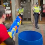 From Songkran splashes to handcuffs: Two Hong Kong men arrested for shooting humourless cops with water (video) | Thaiger