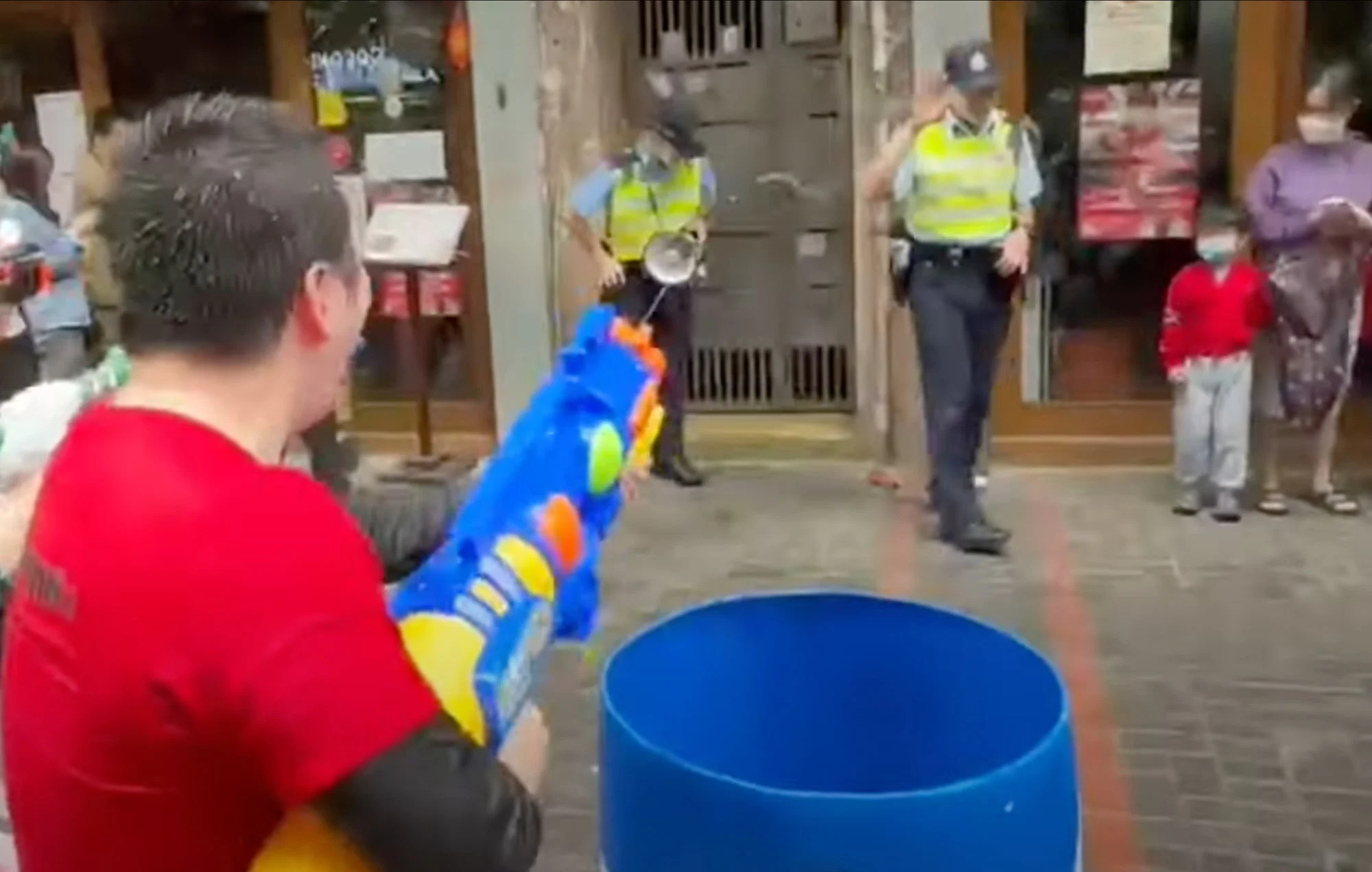 From Songkran splashes to handcuffs: Two Hong Kong men arrested for shooting humourless cops with water (video)