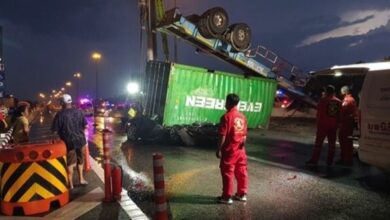 Truck flips in Chon Buri, crushes car and kills young woman