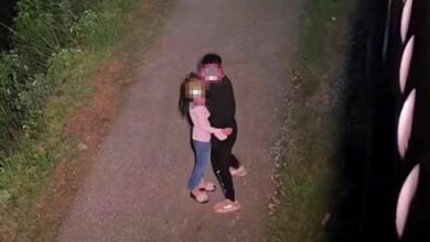 Husband catches wife cheating as street light reveals adulterous embrace