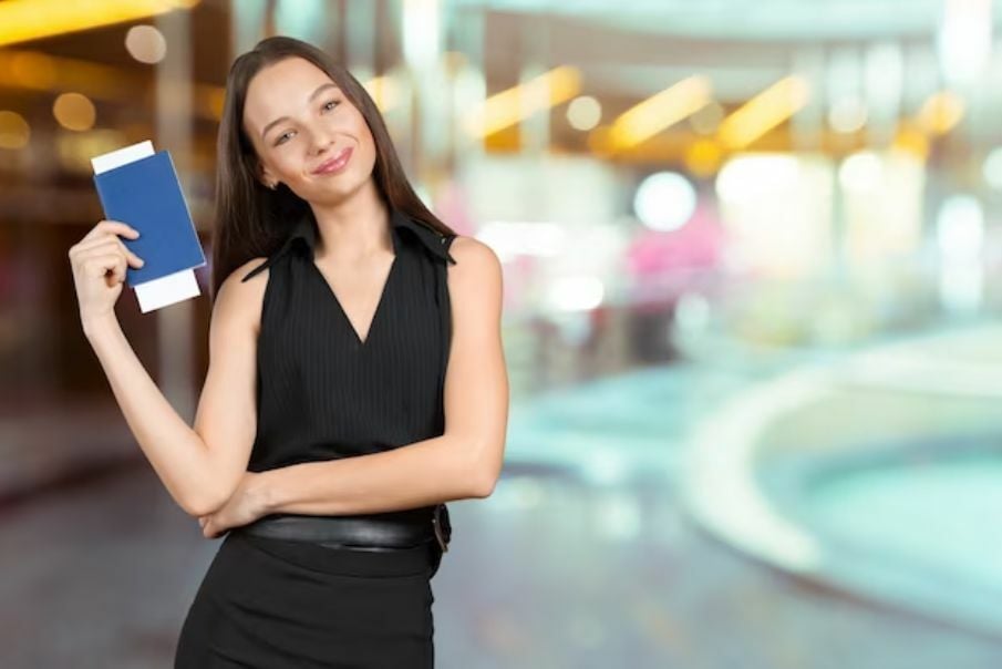 A woman holding the passport